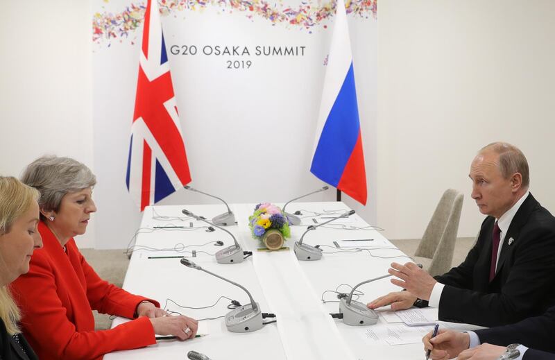 epa07679629 British Prime Minister Theresa May (2-L) and Russian President Vladimir Putin (R) meet on the sidelines of the G20 summit in Osaka, Japan, 28 June 2019.  EPA/MICHAEL KLIMENTYEV/SPUTNIK/KREMLIN POOL MANDATORY CREDIT