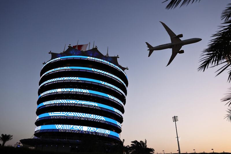 BAHRAIN, BAHRAIN - MARCH 28: A Gulf Air plane flies over the grid prior to the F1 Grand Prix of Bahrain at Bahrain International Circuit on March 28, 2021 in Bahrain, Bahrain. (Photo by Lars Baron/Getty Images)