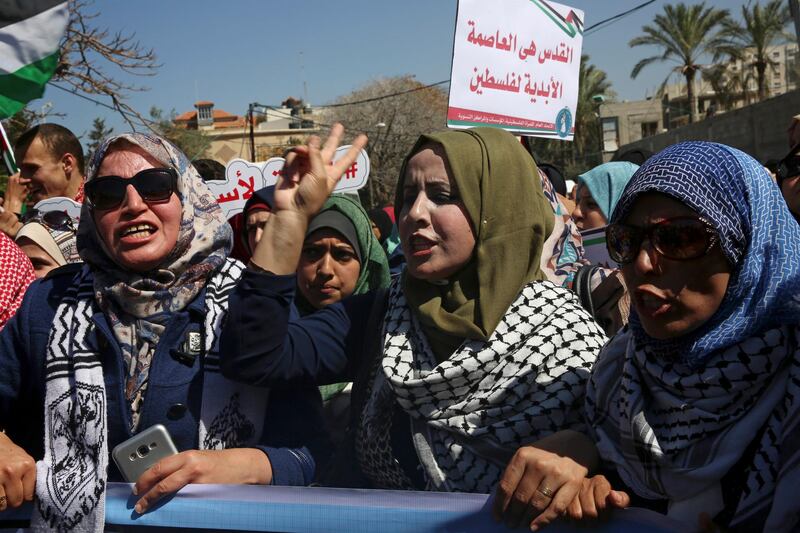 Women chant slogans in front of the main office of the United Nations Special Coordinator for the Middle East Peace Process (UNSCO), during a rally ahead of International Women's Day, in Gaza City, Wednesday, March 7, 2018. Arabic reads, â€œJerusalem is the eternal capital of Palestine.â€ (AP Photo/Adel Hana)