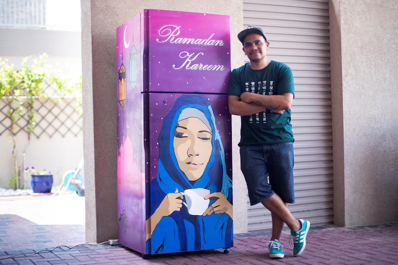 DUBAI, UNITED ARAB EMIRATES - May 9 2019.

Street artist Stainz have spray painted the Ramadan fridge outside Silvia Kunsleben's villa.

(Photo by Reem Mohammed/The National)

Reporter: NICK WEBSTER
Section: NA