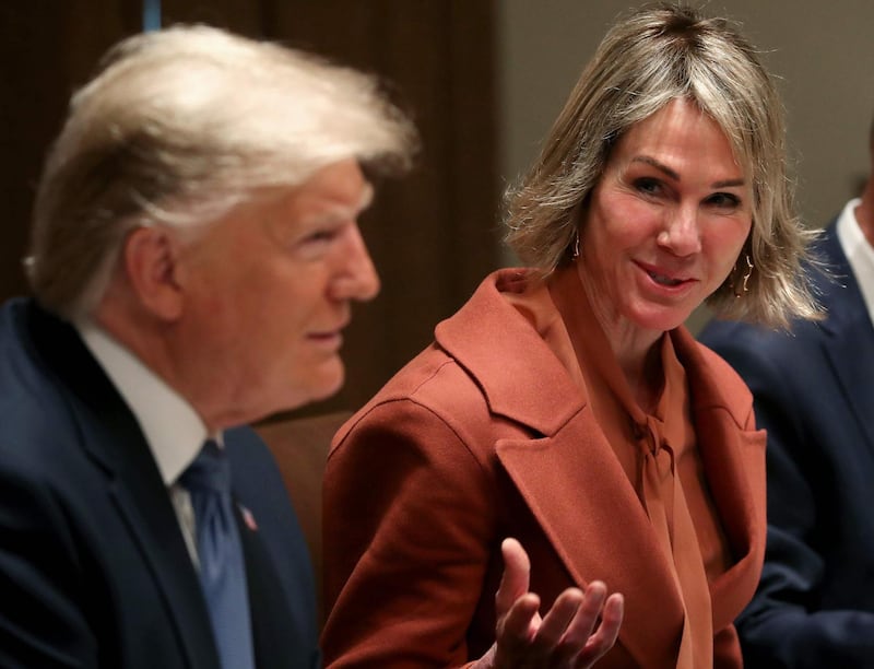 (FILES) In this file photo taken on December 5, 2019, US President Donald Trump (L) and Ambassador to the UN, Kelly Craft, speak to the media during a luncheon with representatives of the United Nations Security Council at the White House in Washington, DC.    The US said on June 5, 2020, it had shared a draft UN resolution with rival Russia that aims to extend an arms embargo on Iran that expires in October. Craft said Washington had shared a draft resolution on the extension with Russia as well as Western allies Britain, France, Germany and Estonia which are all on the 15-nation Security Council. / AFP / GETTY IMAGES NORTH AMERICA / MARK WILSON
