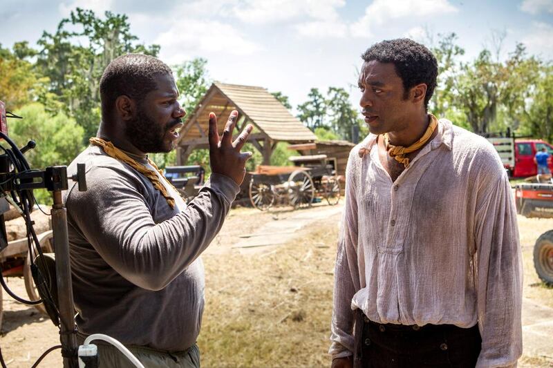 The director Steve McQueen, left, and the actor Chiwetel Ejiofor filming 12 Years A Slave. Jaap Buitendijk / courtesy Fox Searchlight / AP