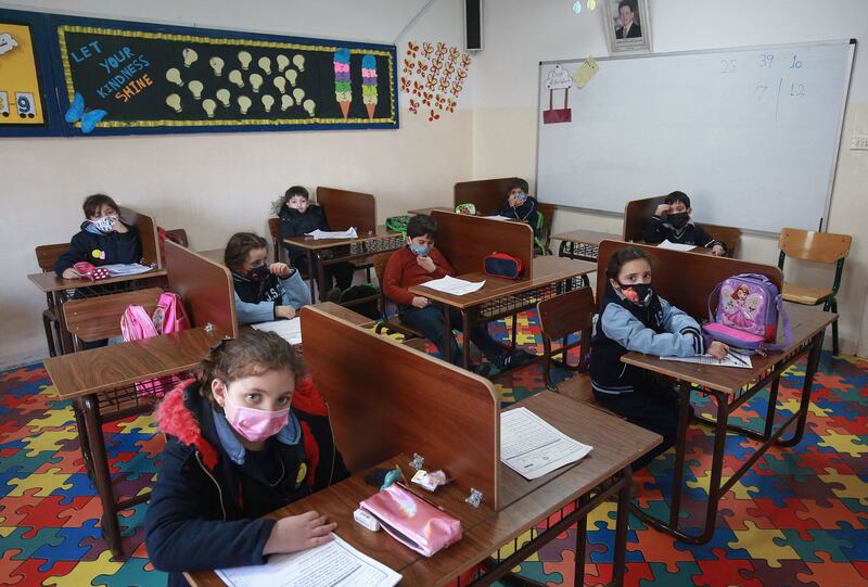 Pupils wear face masks in a classroom in Amman, on February 7, 2021. Schools in Jordan are gradually reopening after a governmental directive to ease Covid-19 restrictions. Photo: AFP