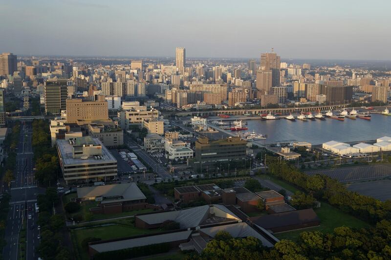 Commercial and residential buildings stand at dusk in Chiba, Japan, on Saturday, Aug. 15, 2020. Japan’s economy shrank last quarter by the most in data going back to 1955 as shoppers stayed home and factory production lines were idled amid a virus-triggered state of emergency and lockdowns in the country’s major export markets. Photographer: Bloomberg/Toru Hanai