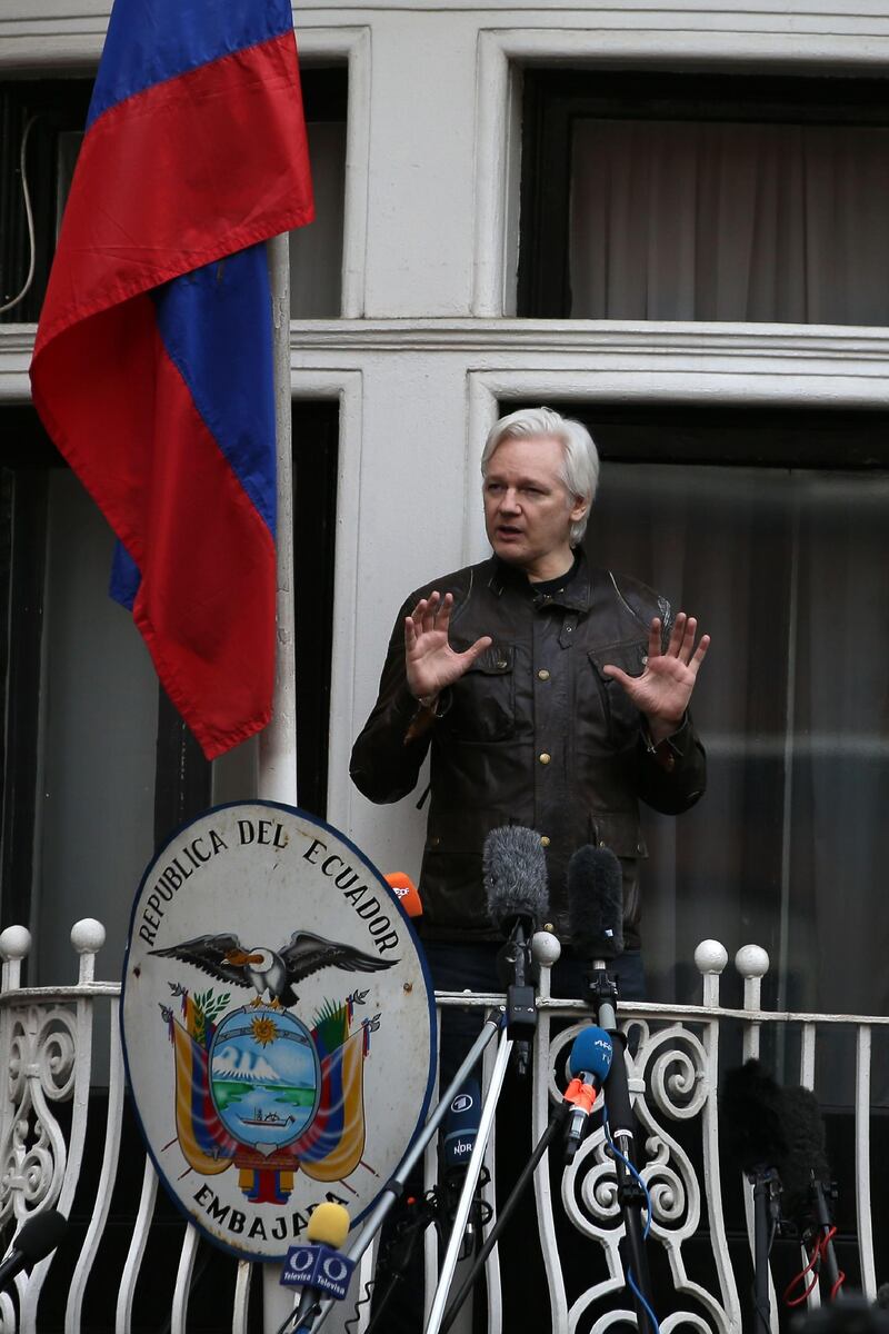 (FILES) In this file photo taken on May 19, 2017 Wikileaks founder Julian Assange speaks on the balcony of the Embassy of Ecuador in London. WikiLeaks founder Julian Assange fathered two children with one of his lawyers while holed up in Ecuador's embassy in London for much of the past decade, according to a report Sunday, April 12, confirmed by the kids' mother. / AFP / Daniel LEAL-OLIVAS
