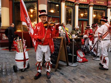 Members of Ewell St.  Mary's Morris Men dancing team prepare to perform Morris dance at Leadenhall Market to celebrate St George's Day in London, Britain, 23 April 2024.  Morris dancing is a form of English folk dance that roots back to the 15th century.  Saint George's Day is celebrated by Christian churches on 23 April, the traditionally accepted date of the saint's death.   EPA / TOLGA AKMEN