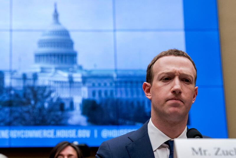 FILE - In this April 11, 2018, file photo, Facebook CEO Mark Zuckerberg pauses while testifying before a House Energy and Commerce hearing on Capitol Hill in Washington about the use of Facebook data to target American voters in the 2016 election and data privacy. Zuckerberg said Facebook will start to emphasize new privacy-shielding messaging services, a shift apparently intended to blunt both criticism of the company's data handling and potential antitrust action. (AP Photo/Andrew Harnik, File)