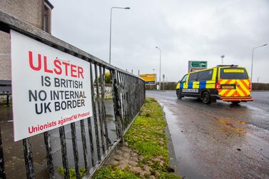 A placard reads "Ulster is British, No internal UK border" near the Port of Larne in Northern Ireland. Bloomberg.