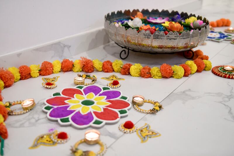 Lighting and rangoli decorations for Diwali at Anil Grover's house in Dubai. Khushnum Bhandari / The National
