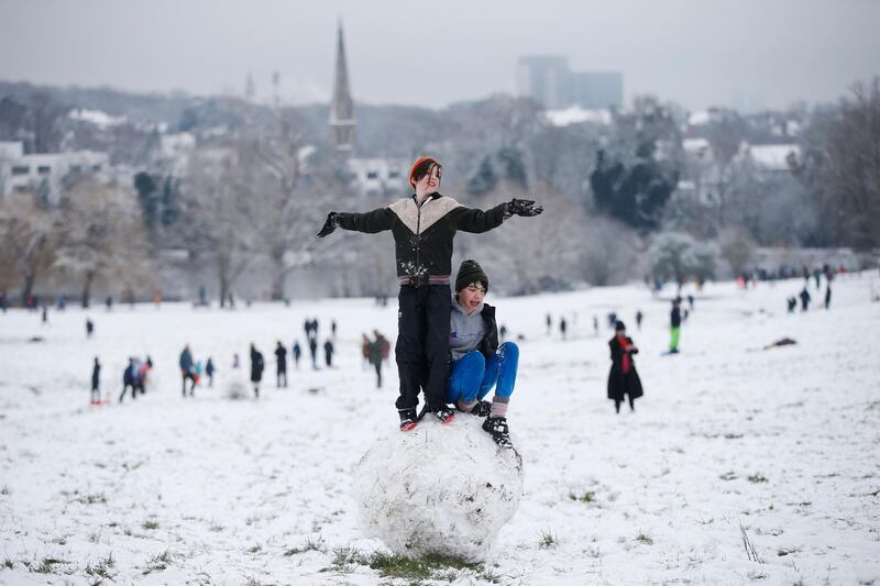 Youngsters make a giant snowball on Hampstead Heath in London, United Kingdom. Parts of the country saw snow and icy conditions as arctic air caused temperatures to drop. Getty Images