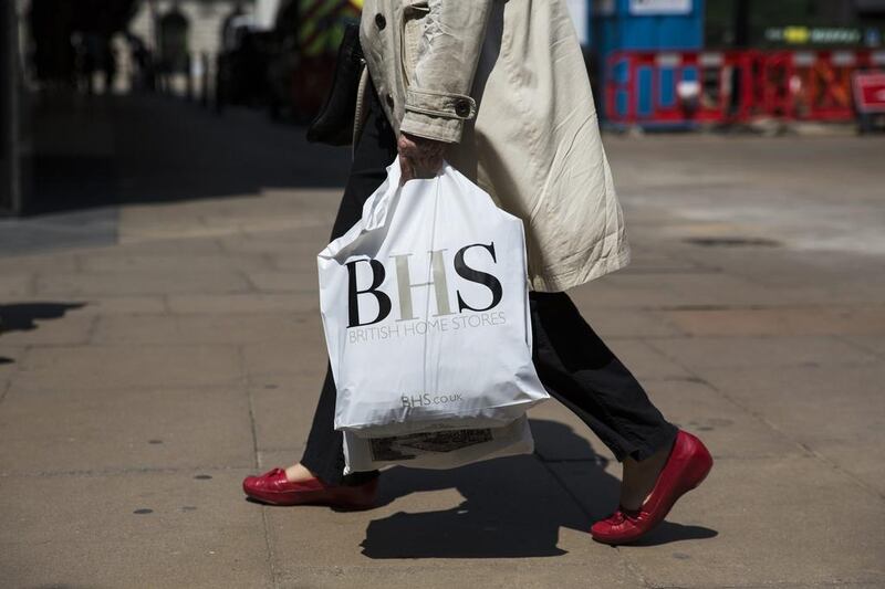 A shopper carries a BHS bag on Oxford Street in London. The BHS saga continues to unfold. Jack Taylor / Getty Images