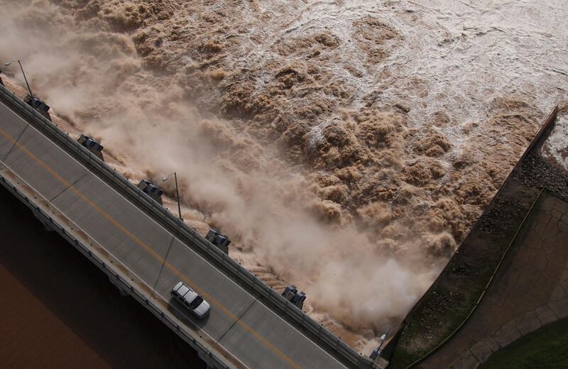 Water is released from the Keystone Dam into the Arkansas River northwest of Tulsa, Oklahoma. The US Army Corps of Engineers began increasing the amount of water being released from the dam on Friday to control the flooding. AP