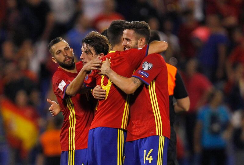 Spain's Saul Niguez, right, celebrates with teammate Aritz Aduriz at the end of the World Cup Group G qualifying soccer match between Spain and Albania at the Rico Perez stadium in Alicante, Spain, Friday, Oct. 6, 2017. Spain won 3-0 and qualified for the 2018 tournament finals. (AP Photo/Alberto Saiz)