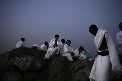 Muslim pilgrims pray on the Mountain of Mercy, on the Plain of Arafat. Nariman El-Mofty / AP Photo