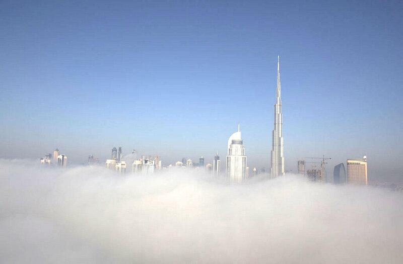The Downtown Dubai skyline protrudes from early morning fog on September 6, 2011. Pawel Dwulit / The National
