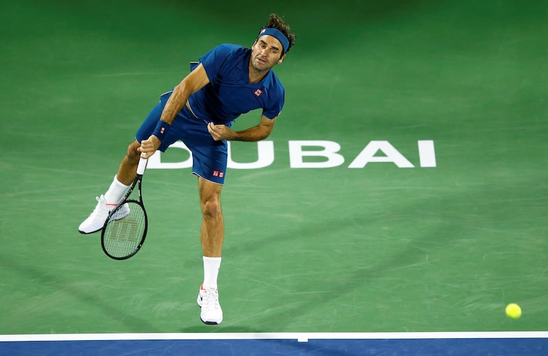 Roger Federer serves to Philipp Kohlschreiber. EPA