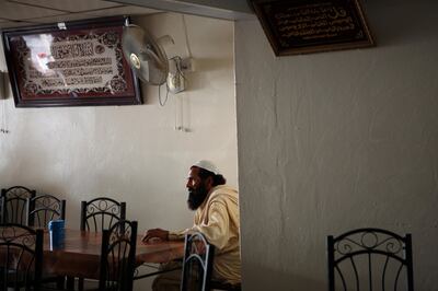 United Arab Emirates - Liwa - April 8, 2011.

NATIONAL/ON LOCATION: 
Gul Khan, 60, from Khyber, waits for his meal at the White Sands Restaurant, the only cafe around for kilometers in the Liwa desert on Friday, April 8, 2011. Previously, a gardener in Al Ain for 20 years, Khan was moved to Liwa where he now waters trees along the desert highway. "I was happy in Al Ain in the city. Here I'm always alone. If this restaurant was not here I would die in the desert," said Khan. Amy Leang/The National