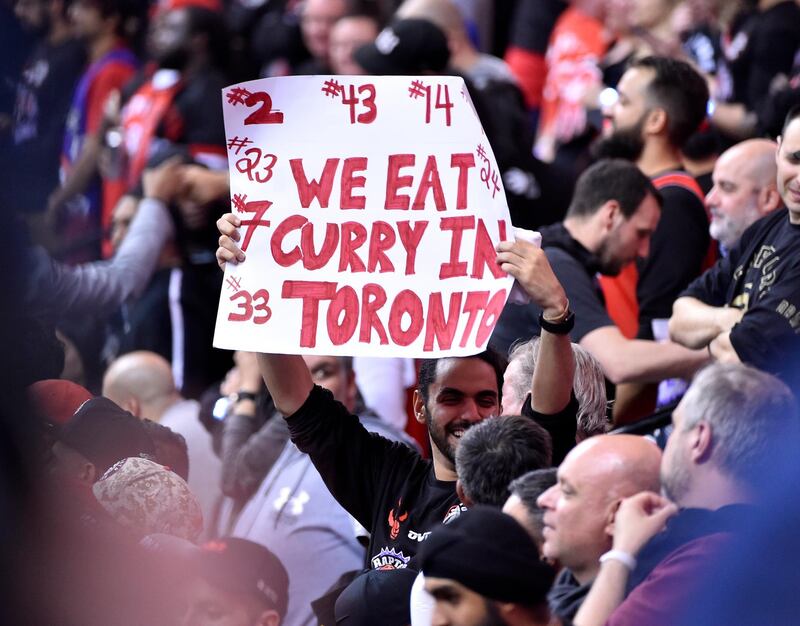 Toronto Raptors holds up a sign during a play against the Golden State Warriors. EPA