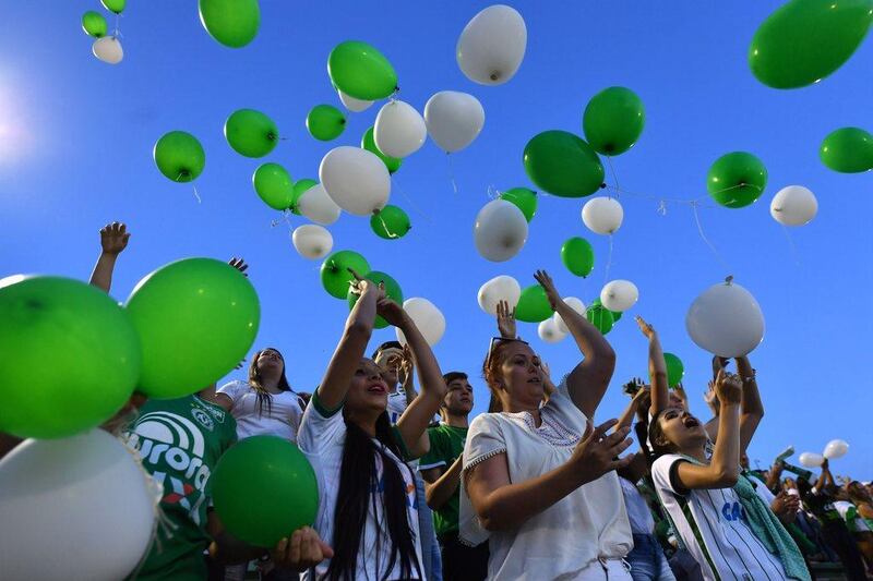 Fans of Brazil’s Chapecoense football club release balloons at the club’s stadium in Chapeco, on November 30, 2016, in tribute to the players killed in a plane crash Monday night in Colombia. Nelson Almeida / Agence France-Presse 