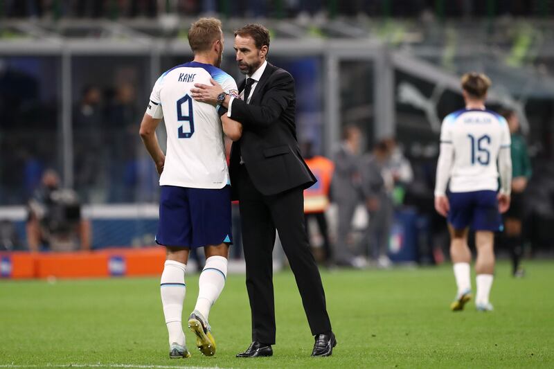 England's Harry Kane shakes hands with coach Gareth Southgate. Getty