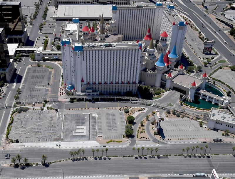 An aerial view shows empty parking lots at the Excalibur Hotel & Casino, which has been closed since March 17 in response to the coronavirus (COVID-19) pandemic in Las Vegas, Nevada.  AFP