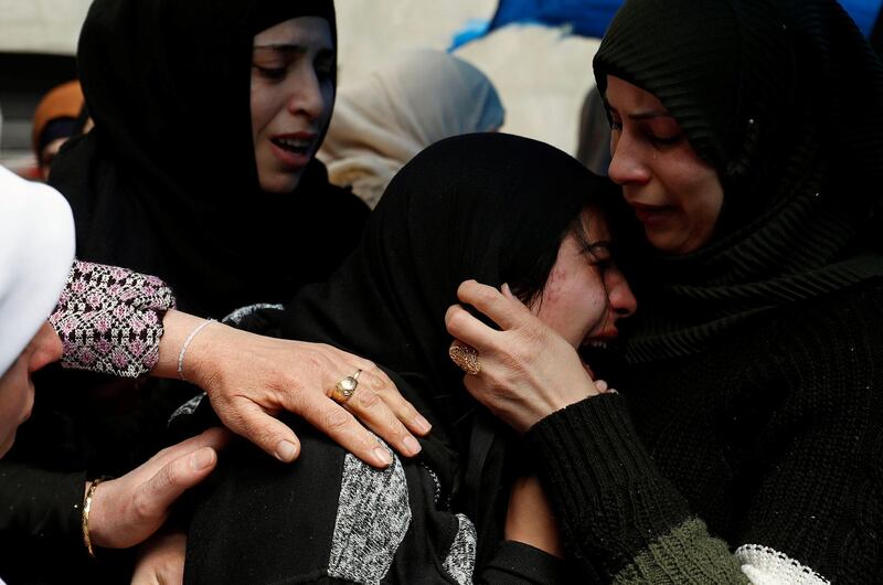Relatives mourn during the funeral of Palestinian Mohamad Edwan near Ramallah, in the Israeli-occupied West Bank. Reuters