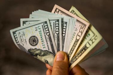 The US dollar eased 0.1 per cent against a basket of currencies and it is down 0.4 per cent for the week. Getty Images
