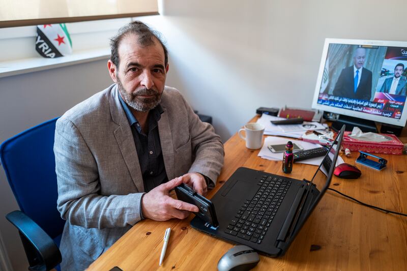 Syrian human rights lawyer Anwar al-Bunni poses in his office in Berlin on April 9, 2020. - When Anwar al-Bunni crossed paths with fellow Syrian Anwar Raslan in a DIY store in Germany five years ago, he recognised him as the man who had thrown him into prison around a decade earlier. On Thursday, April 23, 2020 the two men will face each other in a German court, where Raslan will be one of two alleged former Syrian intelligence officers in the dock accused of carrying out crimes against humanity for Bashar al-Assad's regime. (Photo by John MACDOUGALL / AFP)