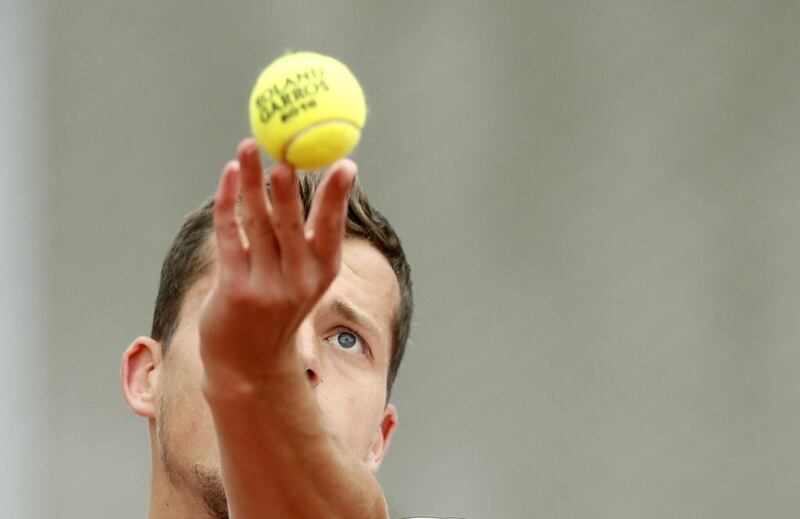 Adam Pavlasek of the Czech Republic in action against Roberto Carballes Baena of  during their men’s single first round match at the French Open tennis tournament at Roland Garros in Paris, France, 23 May 2016. Etienne Laurent / EPA