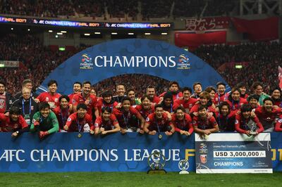 SAITAMA, JAPAN - NOVEMBER 25:  Urawa Red Diamonds players and staffs pose for photographs after the AFC Champions League Final second leg match between Urawa Red Diamonds and Al-Hilal at Saitama Stadium on November 25, 2017 in Saitama, Japan.  (Photo by Etsuo Hara/Getty Images)