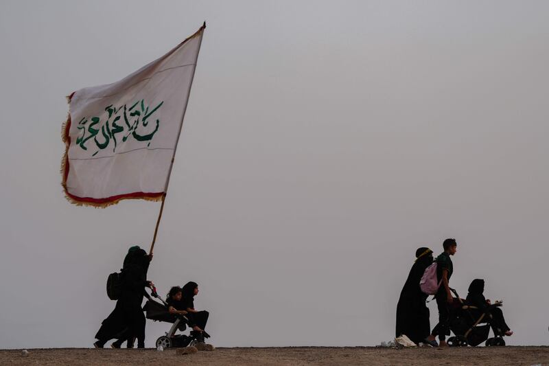 Shiite Muslim pilgrims walk through the city of Nasiriyah in Iraq's southern Dhi Qar province.