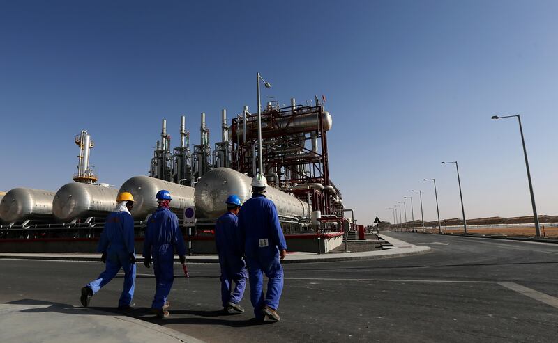 TO GO WITH STORY BY ALI KHALIL
Workers walk inside the Shams 1, Concentrated Solar power (CSP) plant, in al-Gharibiyah district on the outskirts of Abu Dhabi, on March 17, 2013 during the inauguration of the facility. Oil-rich Abu Dhabi officially opened the world's largest Concentrated Solar Power (CSP) plant, which cost $600 million to build and will provide electricity to 20,000 homes. AFP PHOTO/MARWAN NAAMANI / AFP PHOTO / MARWAN NAAMANI