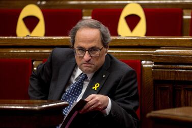 Catalan regional president, Quim Torra, sat next to several yellow ribbons, placed in support of imprisoned Catalan politicians. EPA.