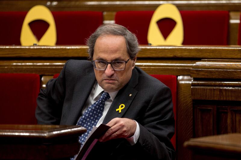 epa07238383 Catalan regional President, Quim Torra, sat next to several yellow ribbons, placed in support of imprisoned Catalan politicians, during the second day of the plenary session of Catalan regional Parliament, in Barcelona, northeastern Spain, 18 December 2018. The session coincides with a hearing at Spain's High Court to deliberate if the Court is competent for judging the case known as 'Proces' case, of which several Catalan separatist leaders are prosecuted for their role in illegal Catalan secession referendum on 01 October 2017 and a bid to break away from Spain that was ruled to be illegal by Spain's judiciary.  EPA/QUIQUE GARCIA