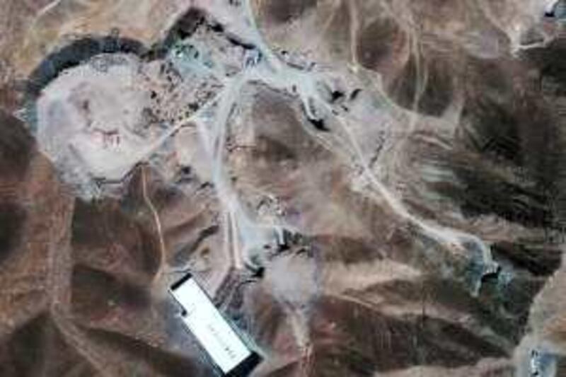 This satellite image taken Saturday Sept. 26, 2009, provided by GeoEye shows a facility under construction inside a mountain located about 20 miles north northeast of Qom, Iran. Although there is no confirmation, analysts at both the Washington-based Institute for Science and International Security and London-based IHS Jane's believe this satellite photo of a site on a military base near Qom, Iran, is most likely the location of the newly revealed centrifuge facility. Analysts at both ISIS and Jane's point to apparent tunnel entrances leading into a mountain. (AP Photo/GeoEye Satellite Image, IHS Jane's Analysis) *** Local Caption ***  NYWWP_Iran_Nuclear.jpg