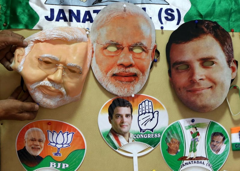 Badges, stickers, t-shirts, caps, logos, flags and masks of different political party are on display in a shop in Bangalore. EPA