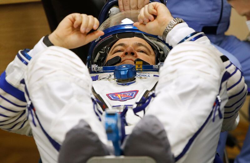 Oleg Skripochka has his space suit inspected before launch. Dmitri Lovetsky / AP