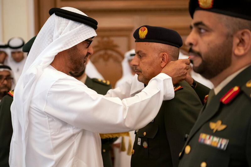 ABU DHABI, UNITED ARAB EMIRATES - April 08, 2019: HH Sheikh Mohamed bin Zayed Al Nahyan, Crown Prince of Abu Dhabi and Deputy Supreme Commander of the UAE Armed Forces (L), presents an Emirates Military Medals to members of the UAE Armed Forces, Ministry of Interior and Abu Dhabi Police, during a Sea Palace barza.
( Ryan Carter for the Ministry of Presidential Affairs )
---