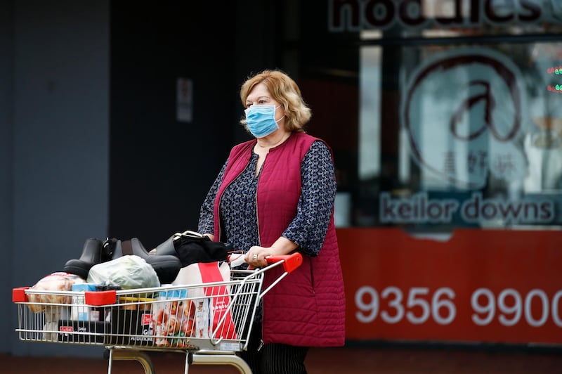 MELBOURNE, AUSTRALIA - JUNE 24: People wearing masks are seen in Keilor Downs on June 24, 2020 in Melbourne, Australia. A man in his 80s died overnight in Victoria from coronavirus, bringing the total number of deaths in the state to 20. The death is the first COVID-19 fatality for Victoria in many weeks and also comes as 20 new coronavirus cases were confirmed today. Victorian Premier Daniel Andrews on Tuesday warned of another possible lockdown should cases continue to rise, and has extended the state of emergency for at least four weeks to allow police the power to enforce social distancing rules. (Photo by Daniel Pockett/Getty Images)