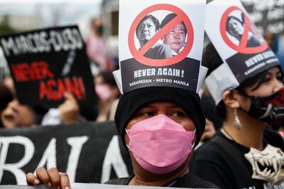 Protesters mark the 36th anniversary of the People Power Revolution at a monument in Quezon City, Philippines. Activists voiced concern over the return of 'a powerful dynasty' during Ferdinand Marcos Jr's election campaign. EPA 