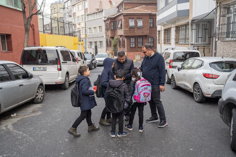 Raed Al Qushta and Ahmed Al Dalou meet their children after school to return to the Istanbul hotel they now call home
