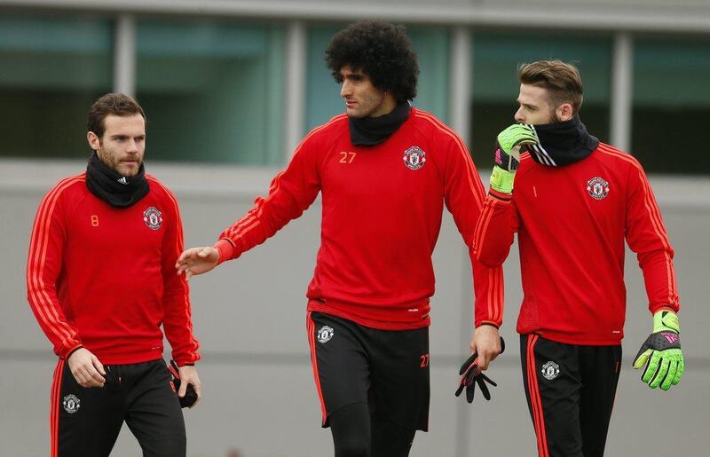 Manchester United’s David De Gea, Marouane Fellaini and Juan Mata arrive for training. Action Images via Reuters / Jason Cairnduff