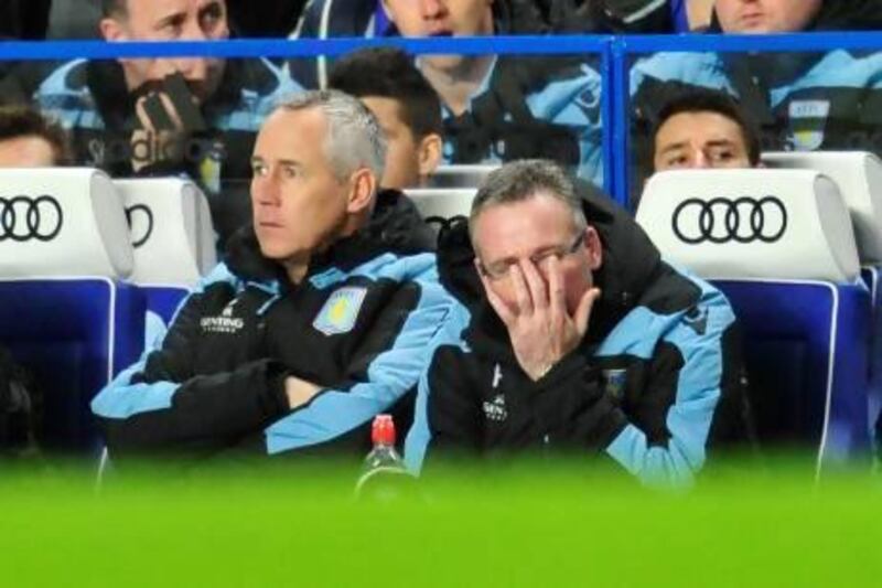 Paul Lambert, the Aston Villa manager, watches as his side are defeated 8-0 by Chelsea.