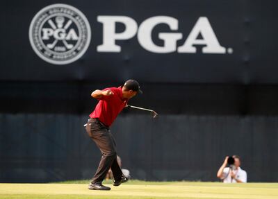 Tiger Woods celebrates his birdie putt on the 18th green during the final round of the PGA Championship golf tournament at Bellerive Country Club, Sunday, Aug. 12, 2018, in St. Louis. (AP Photo/Jeff Roberson)