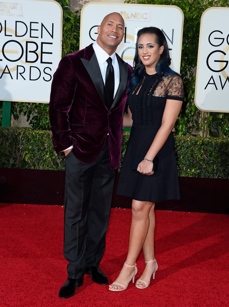 epa05096593 Actor Dwayne Johnson (L) and his daughter Simone Alexandra Johnson arrive for the 73rd Annual Golden Globe Awards at the Beverly Hilton Hotel in Beverly Hills, California, USA, 10 January 2016.  EPA/PAUL BUCK
