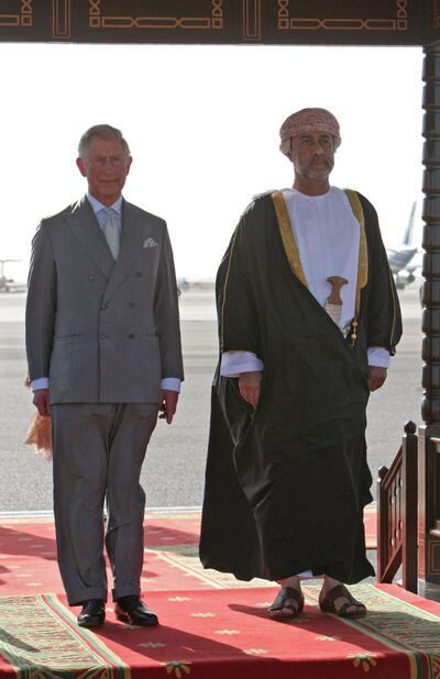 A picture taken on March 17, 2013, shows Oman's then Minister of Culture and Heritage Haitham Bin Tariq Al Said (R) receiving Britain's Prince Charles in the Omani capital Muscat. Oman's new royal ruler Haitham Bin Tariq Al Said pledged to follow the non-interference policy that made the kingdom a vital regional mediator under his late cousin Sultan Qaboos who reigned for half a century. / AFP / Mohammed MAHJOUB
