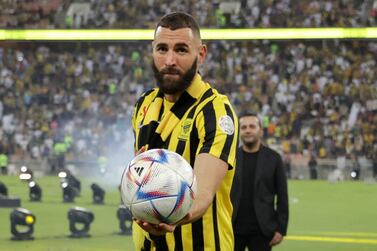 French forward Karim Benzema greets the crowd during his unveiling at King Abdullah Sports City stadium in Jeddah, on June 8, 2023.  Benzema was unveiled as an Al-Ittihad player in front of thousands of fans in Saudi Arabia on June 8, a day after the oil-rich kingdom just failed to reel in Lionel Messi.  (Photo by AFP)