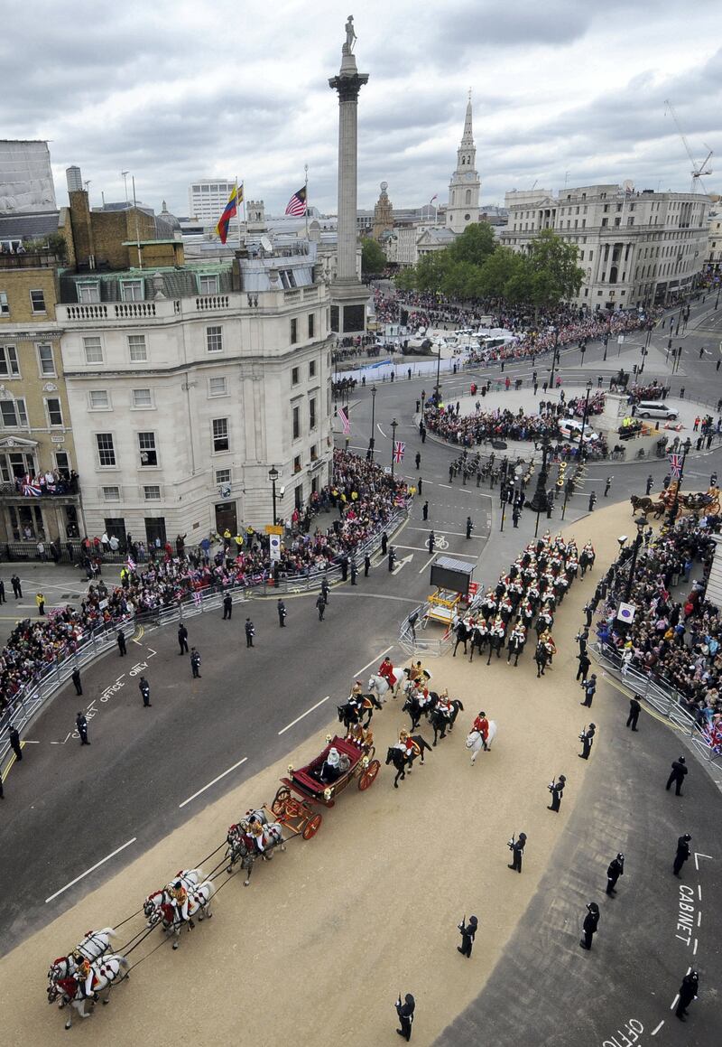 LONDON, UNITED KINGDOM - JUNE 05:  Queen Elizabeth II travels through Trafalgar Square by carriage with Prince Charles, Prince of Wales and Camilla, Duchess of Cornwall on the way to Buckingham Palace during the Diamond Jubilee celebrations on June 5, 2012 in London, England. For only the second time in its history the UK celebrates the Diamond Jubilee of a monarch. Her Majesty Queen Elizabeth II celebrates the 60th anniversary of her ascension to the throne today with a carriage procession and a service of thanksgiving at St Paul's Cathedral. (Photo by Anthony Devlin - WPA Pool/Getty Images)