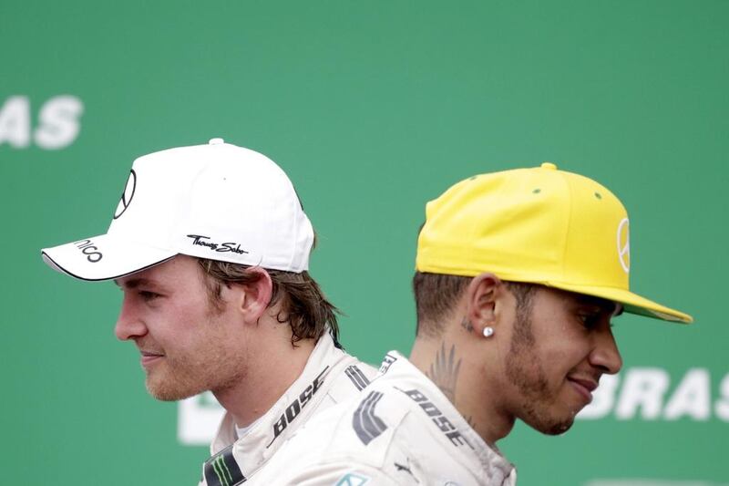 First placed Formula One driver Nico Rosberg, left, of Mercedes and his teammate, second placed Lewis Hamilton on the podium after the 2015 Formula Grand Prix of Brazil at the Interlagos racing track, in Sao Paulo, Brazil, 15 November 2015. EPA/Sebastiao Moreira