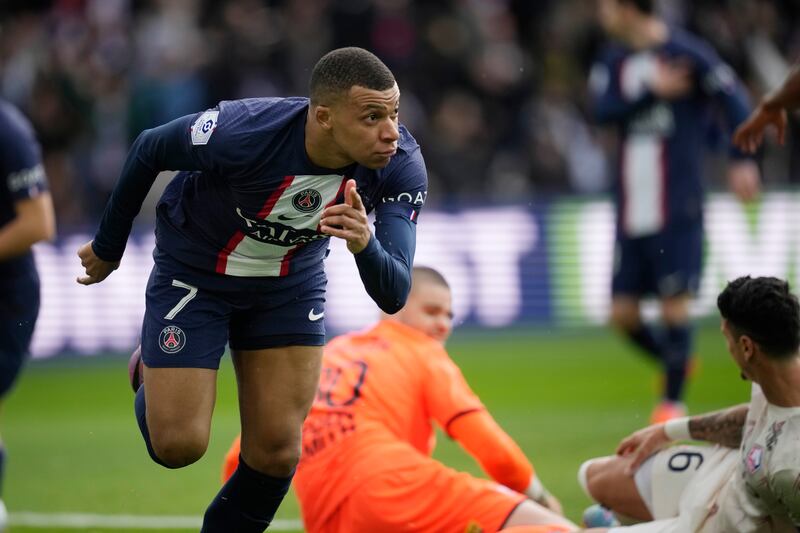 Mbappe celebrates after scoring. AP